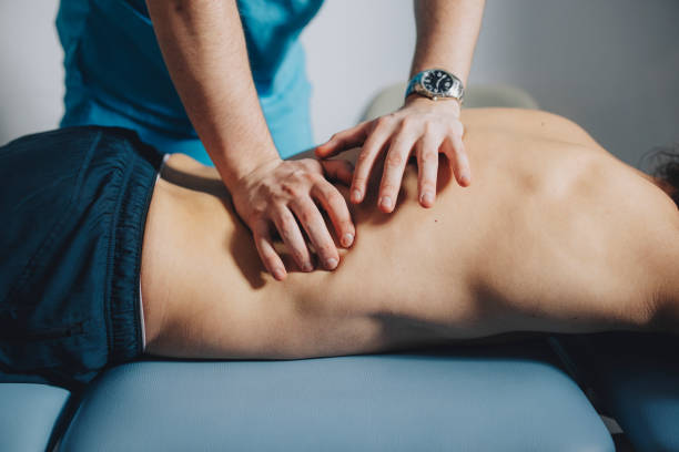 What can I expect during a visit to a back pain chiropractor in Carrollton, TX?